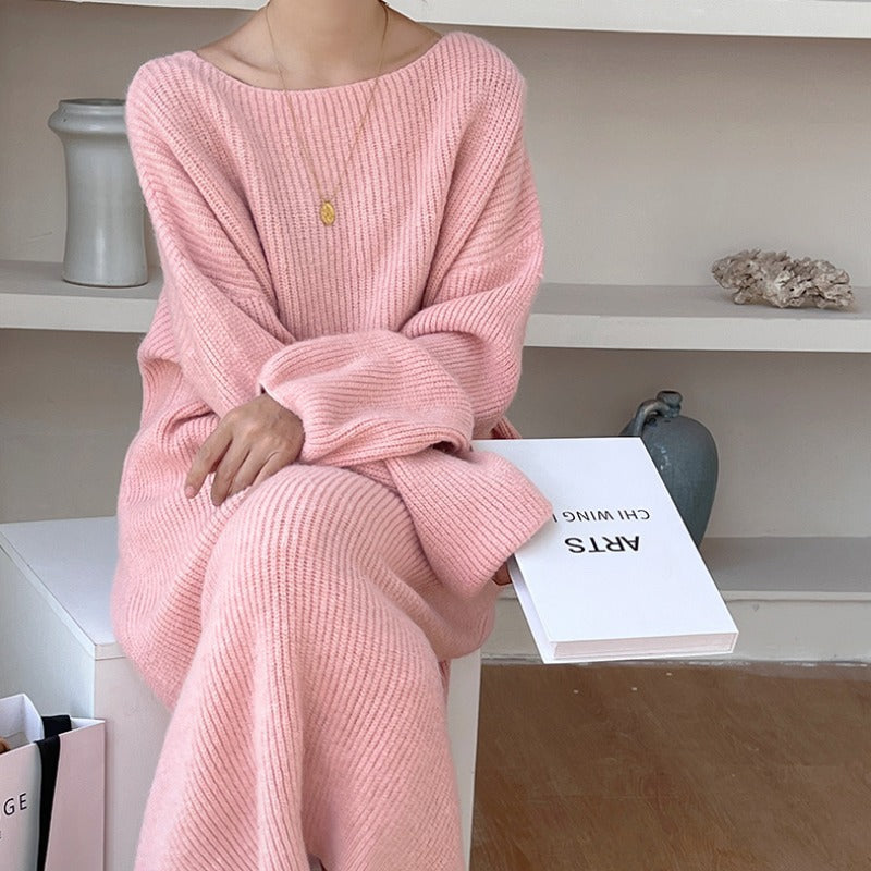 A Knee-length Knitted Sweater Dress Creates A Refined And Elegant Look For The Modern Woman